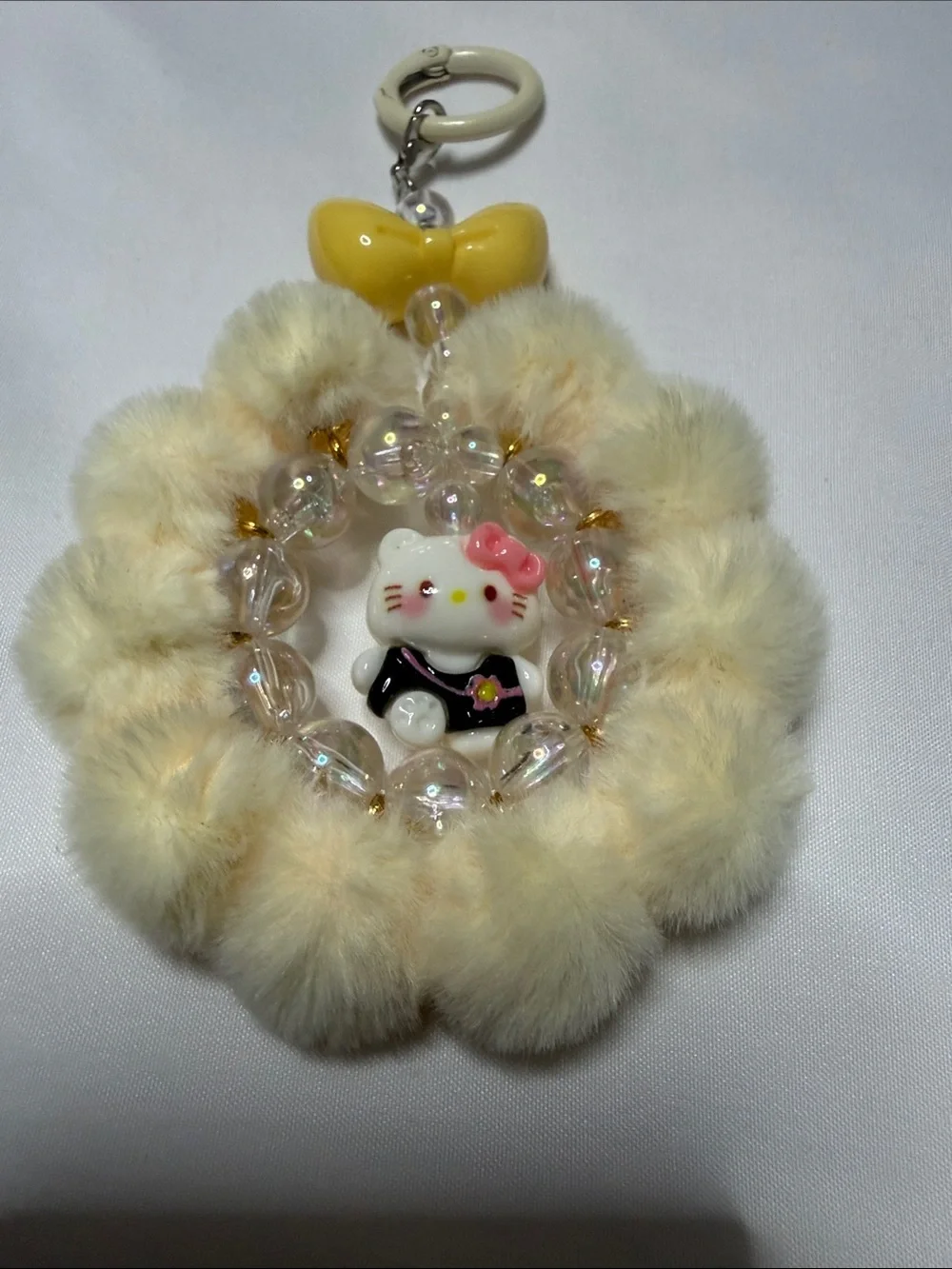 Hello Kitty Cream Faux Fur Pom Keyring with Yellow Bow & Pink Accent